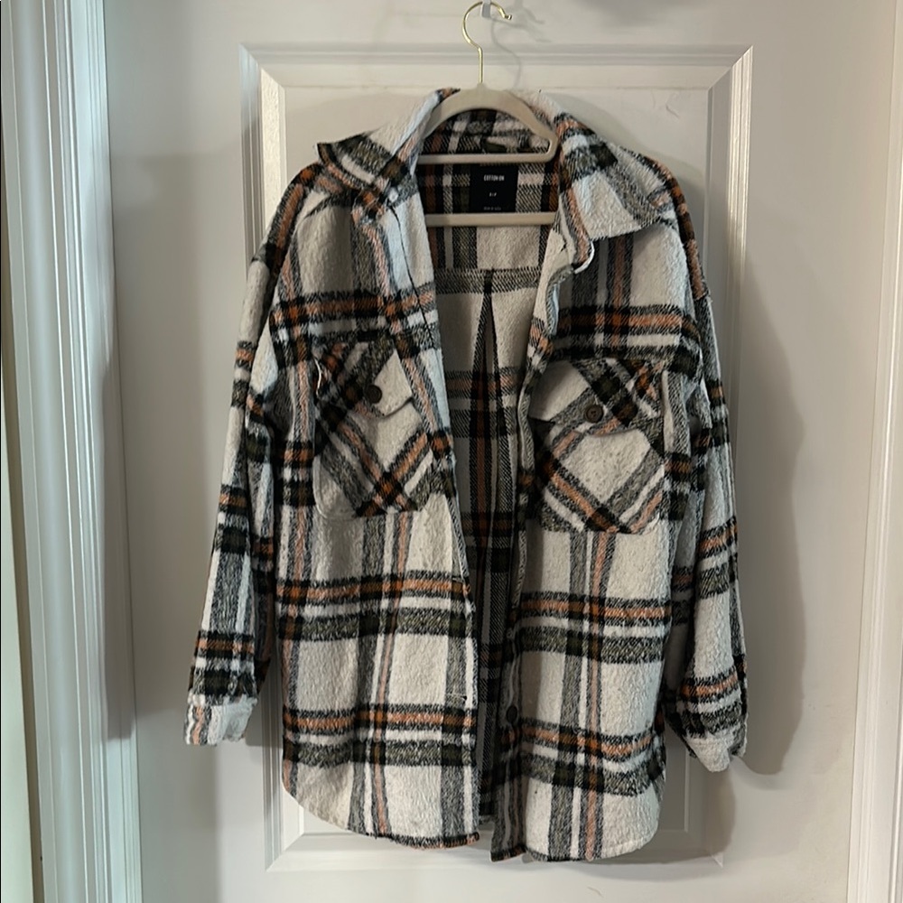 Cotton On Plaid Shirt Jacket in Black, White, and Light Orange.